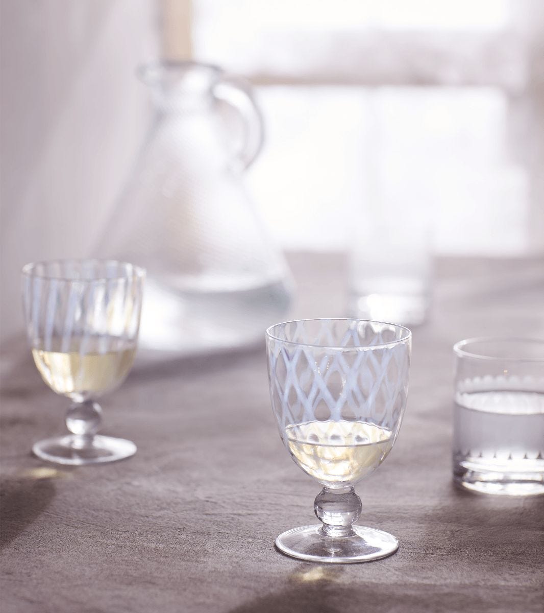 https://www.oka.com/media/catalog/product/p/u/pulcinella-large-wine-glasses-set-of-four-white-a10535-1-13-1275-14-11.jpg?quality=80&fit=bounds&height=&width=