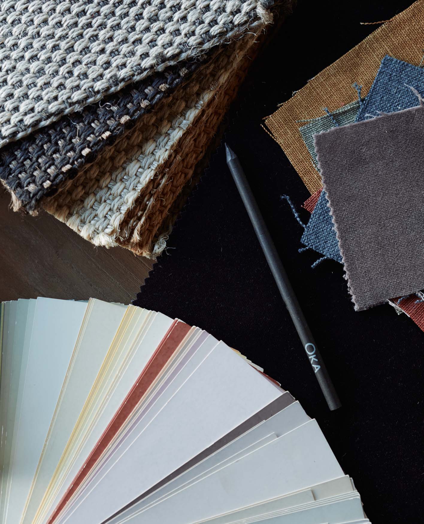 Fabric and colour swatches arranged on a table