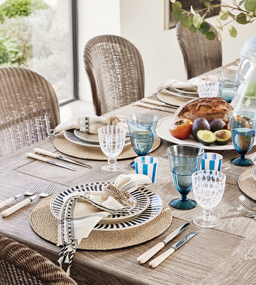 Dining table set with tableware.