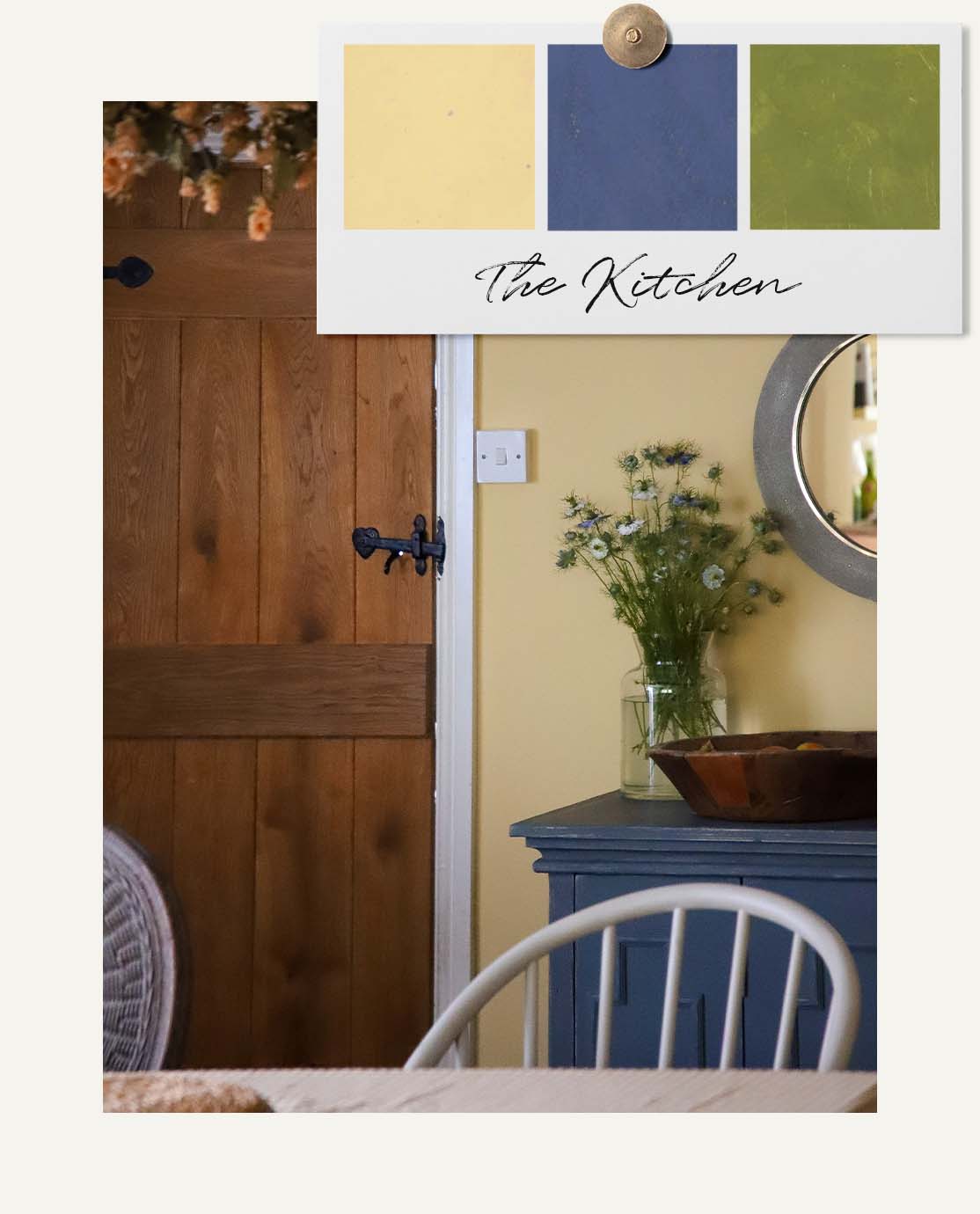 A room with butter yellow walls, a blue sideboard and white chair