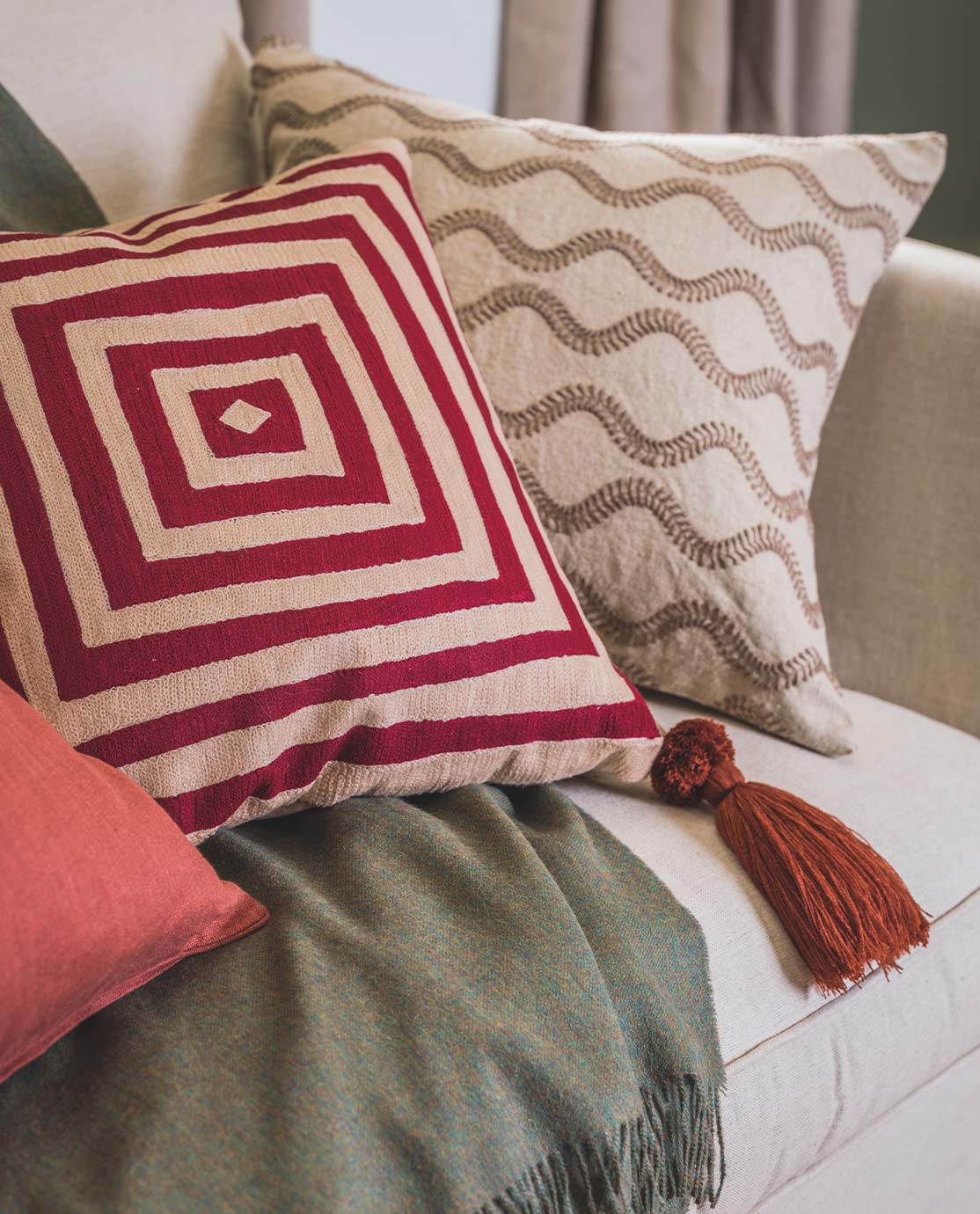 Printed cushions on a white sofa