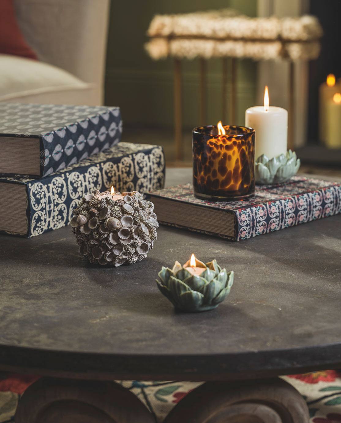 Boxes and candles arranged on a coffee table