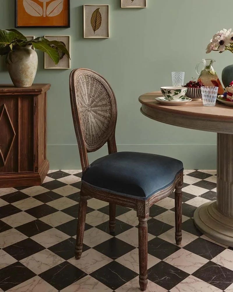 blue velvet chair at a round table