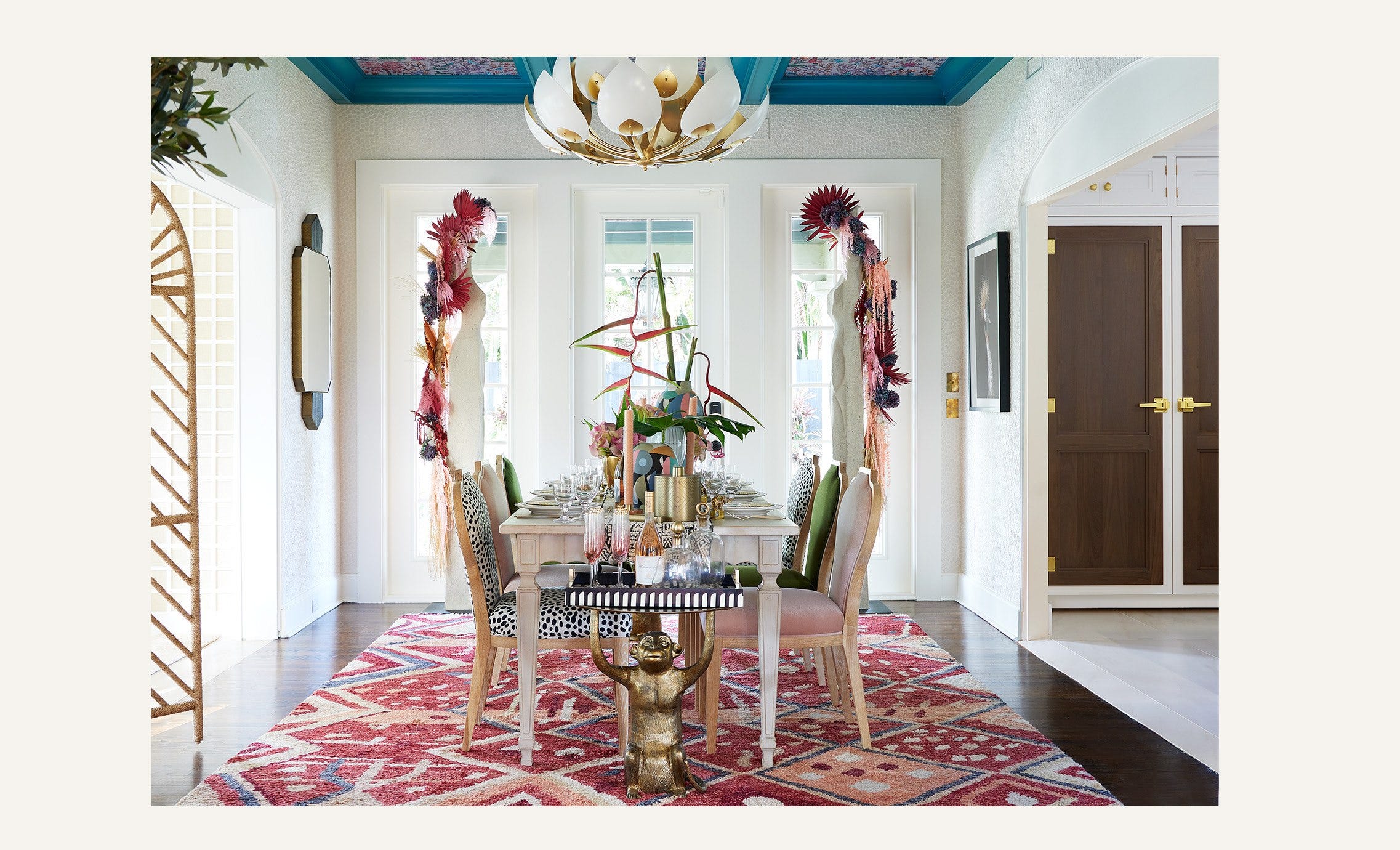 A light, summery dining room setting with lots of blue, pink and animal print accents