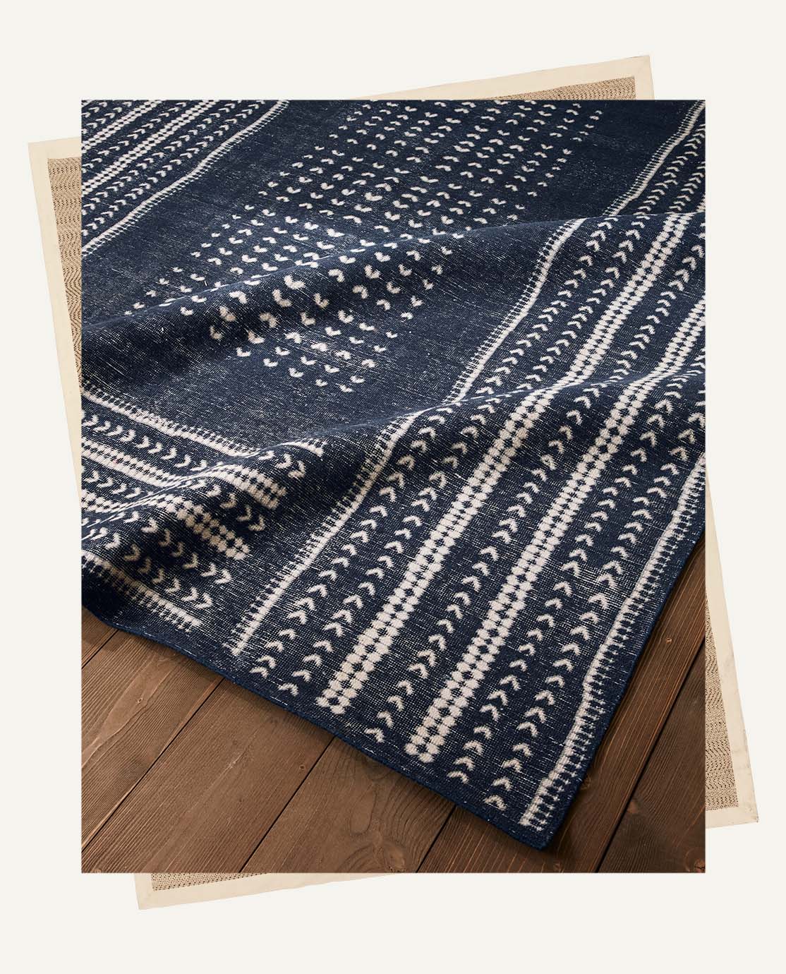 A navy rug with a white abstract print