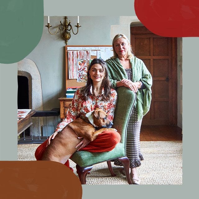 Mother Caryn sat behind daughter Milly who is sat on a chair